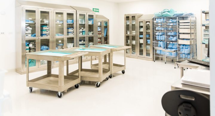 Wide view of a storage room with clean and sterile medical instruments and clothing in a hospital